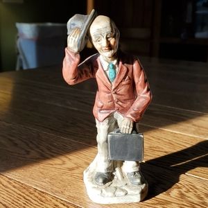 Man sitting on stump, vintage, tipping hat